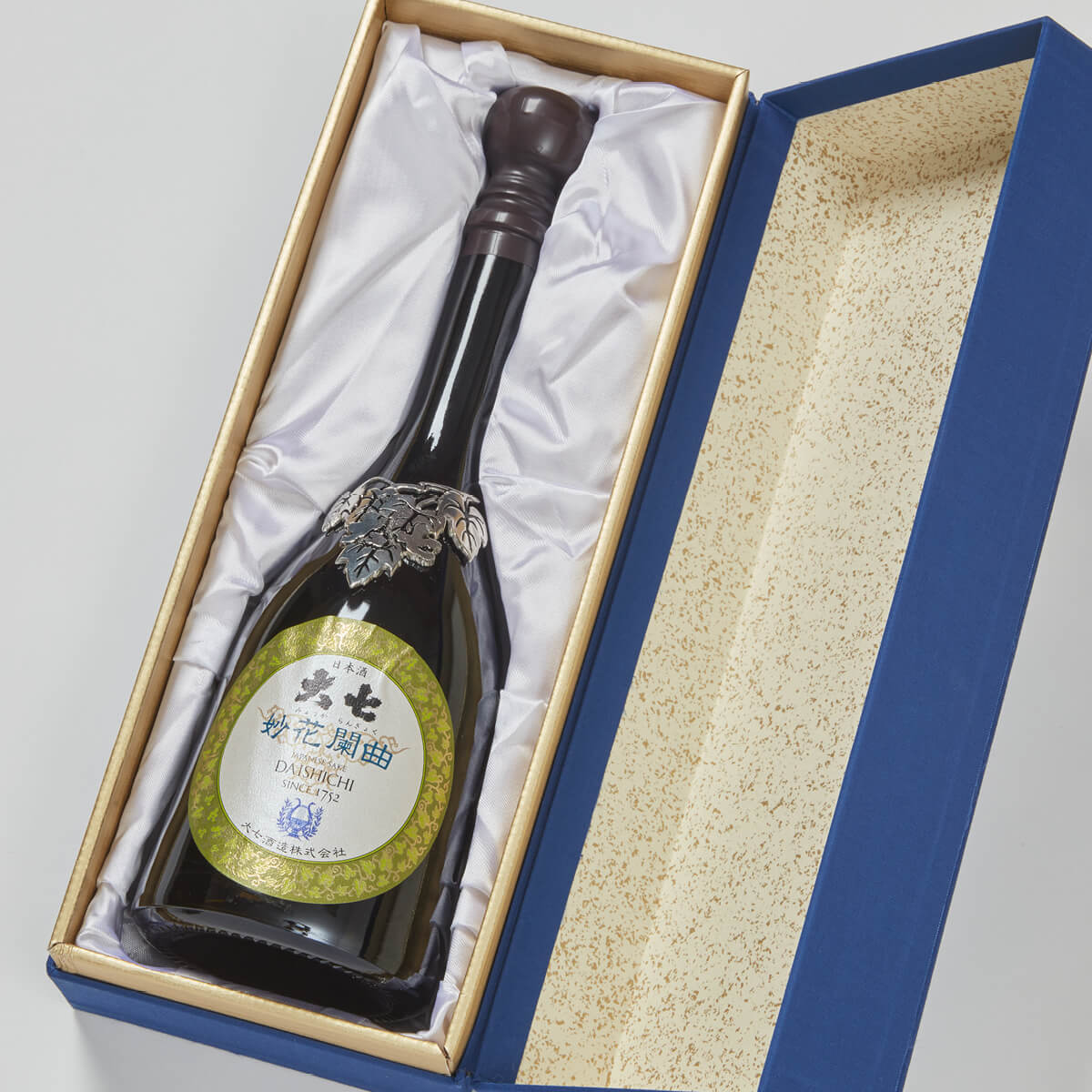 Daishichi “Myoka Rangyoku” Junmai Daiginjo, lying inside a product box