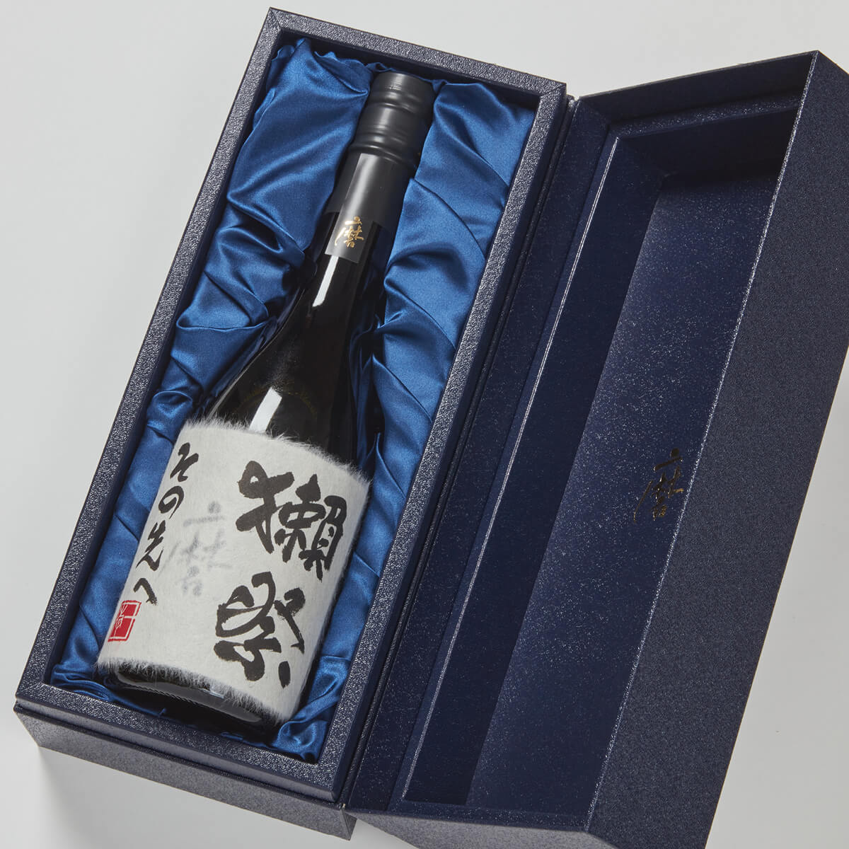 Dassai “Beyond” Junmai Daiginjo, lying inside a product box