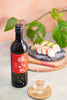 Katsuyama “Ken” Junmai Ginjo, with a clear glass, served with california rolls Thumbnail