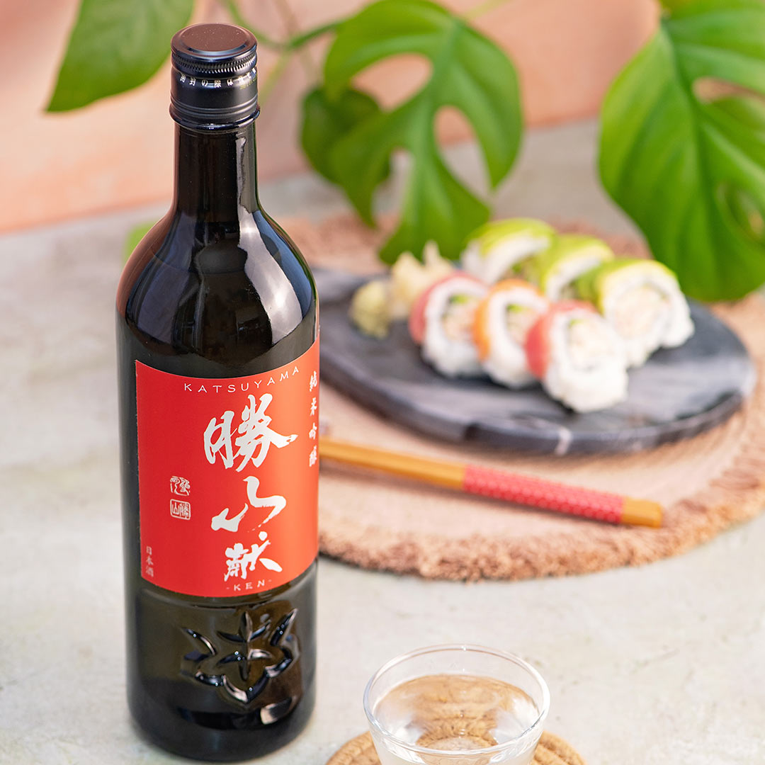 Katsuyama “Ken” Junmai Ginjo, with a clear glass, served with california rolls