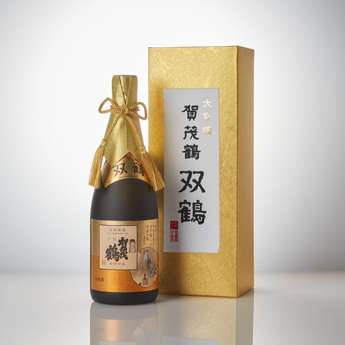 Kamotsuru “Sokaku” Daiginjo, standing in front of a product box