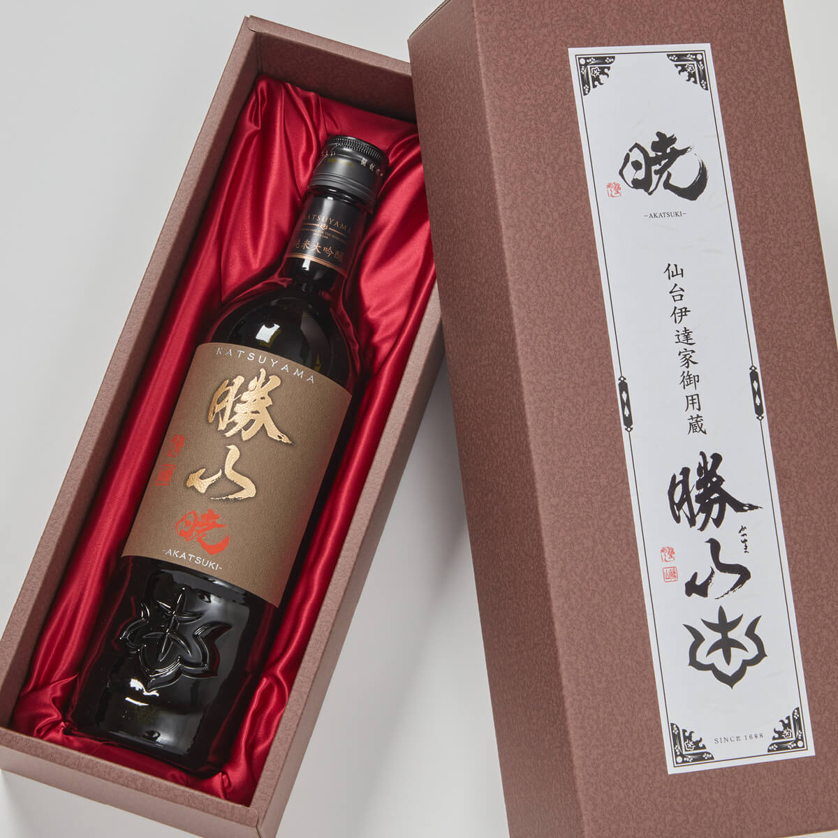 Katsuyama “Akatsuki” Junmai Daiginjo, lying inside a product box