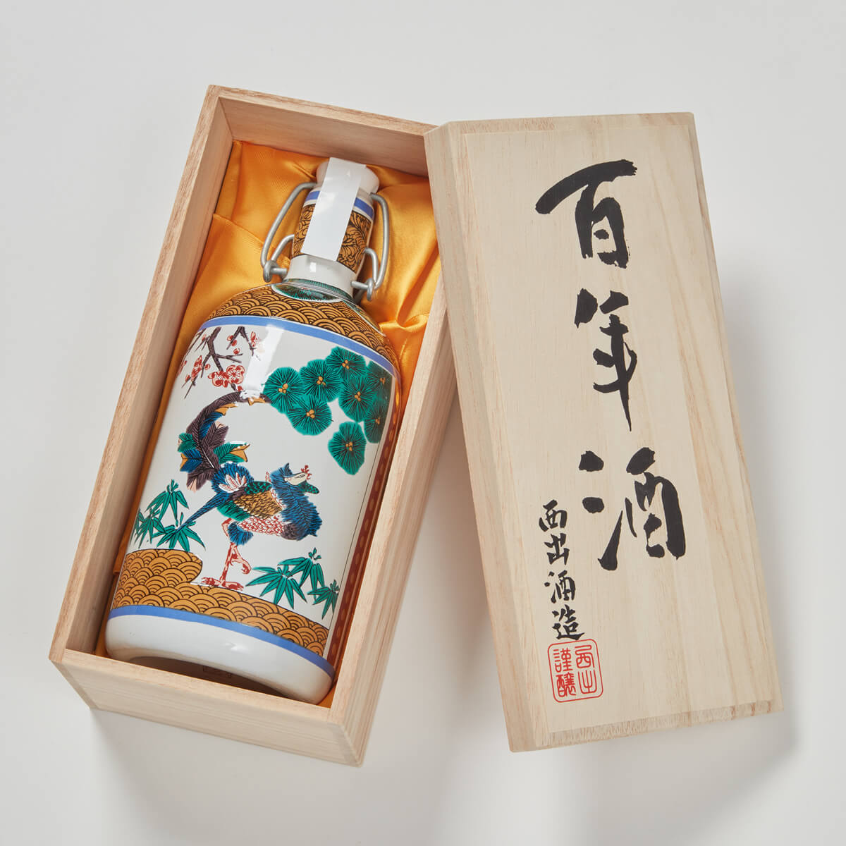 Nishide “100 Year” Junmai Daiginjo, lying inside a product box