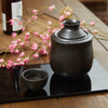Black Sake Set With Warmer, on a table Thumbnail