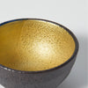 “Mino no Takumi” Black Sakazuki Cup With Blue Drip Glaze and Gold Interior, upward angled close view Thumbnail