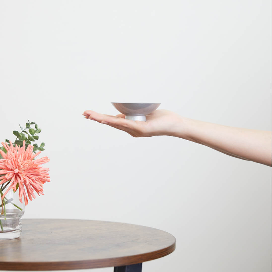 Porcelain Sakazuki Cup With Silver Urushi Lacquer, on a hand