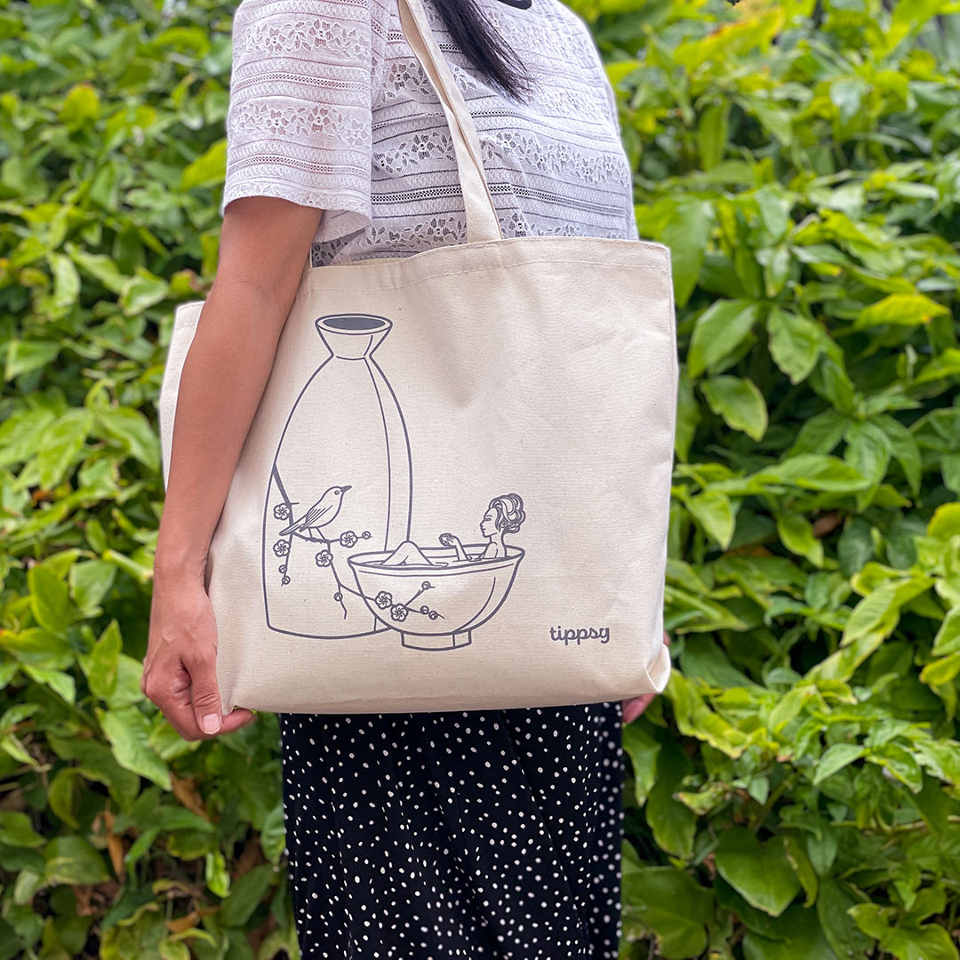 “Team Warm” Tote Bag on a shoulder