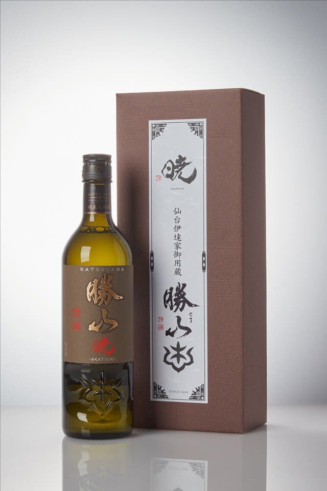 Katsuyama “Akatsuki” Junmai Daiginjo, standing in front of a product box