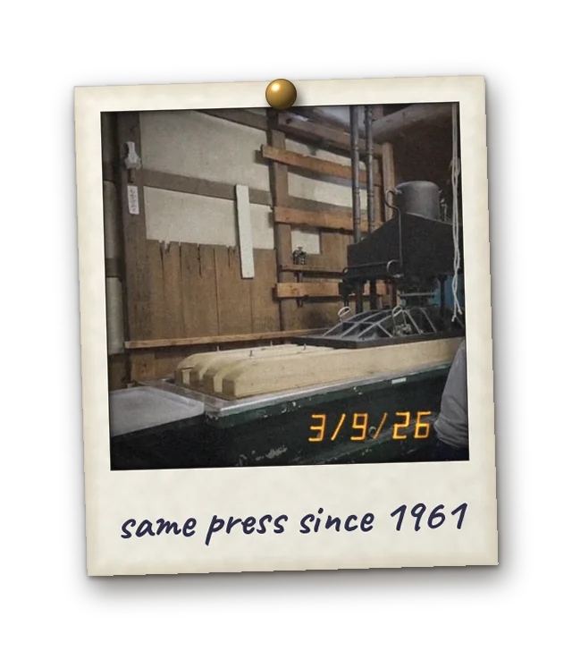 Polaroid: at the wooden fune press. Date stamp 3/9/26. Handwritten: same press since 1961